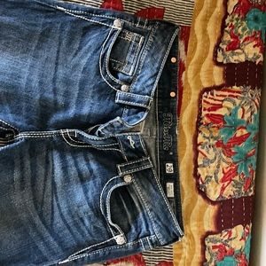 Size 29 Miss Me mid rise bootcut jeans. Only worn two times. Great condition.